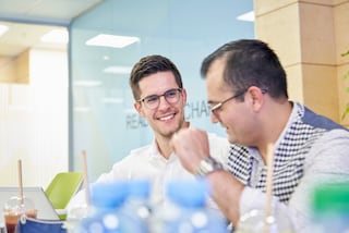 Two colleagues talking in an office