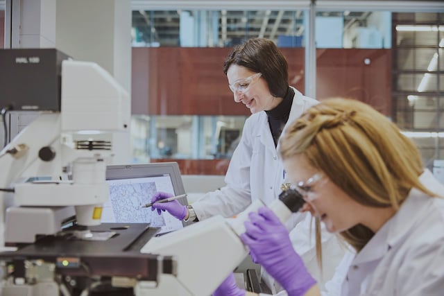 Two female scientists working in laboratory