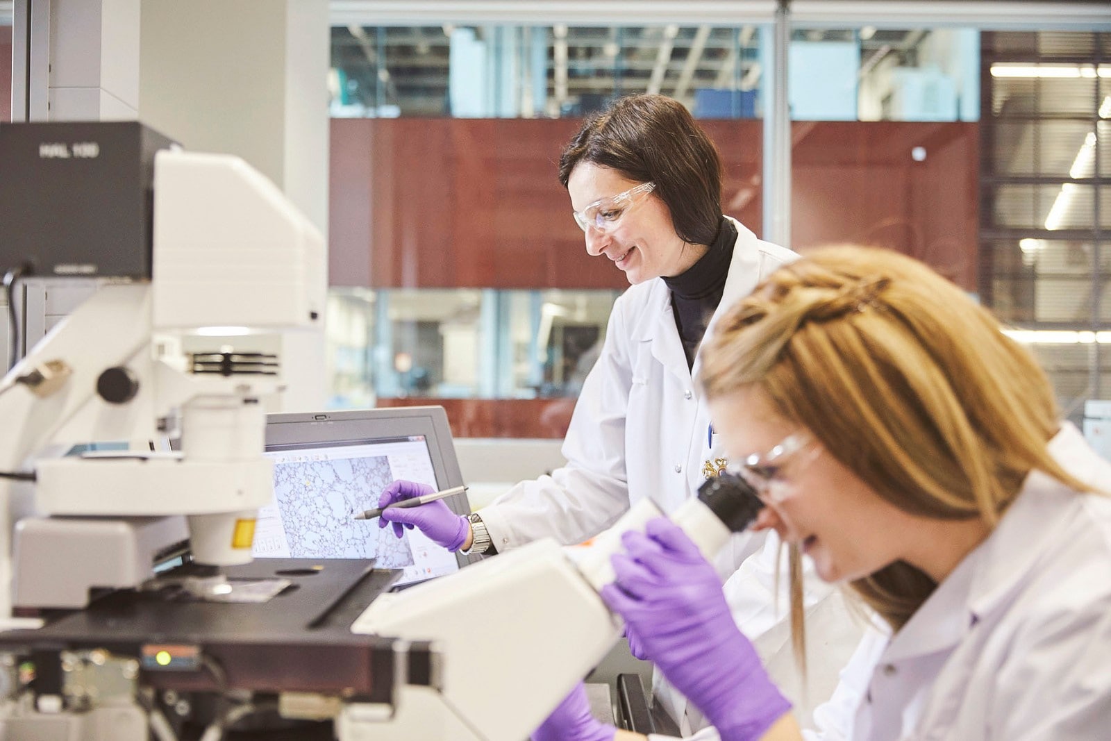 Two female researchers conducting scientific research