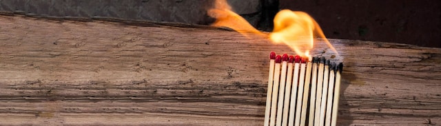 Burning matchsticks on a table