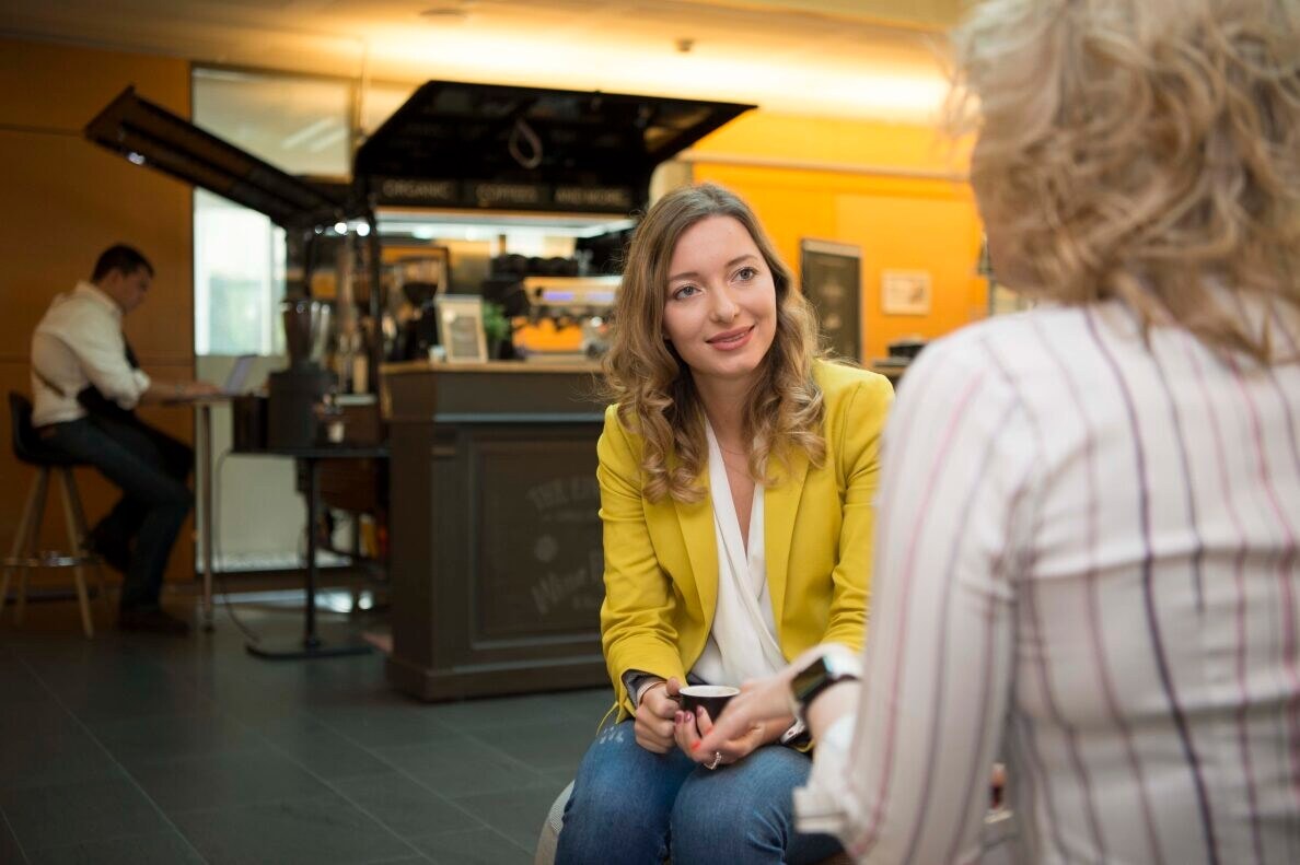 women talking in break area