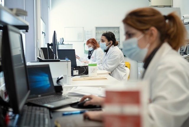 Scientists wearing masks in a laboratory