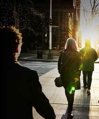 People crossing the street in a city