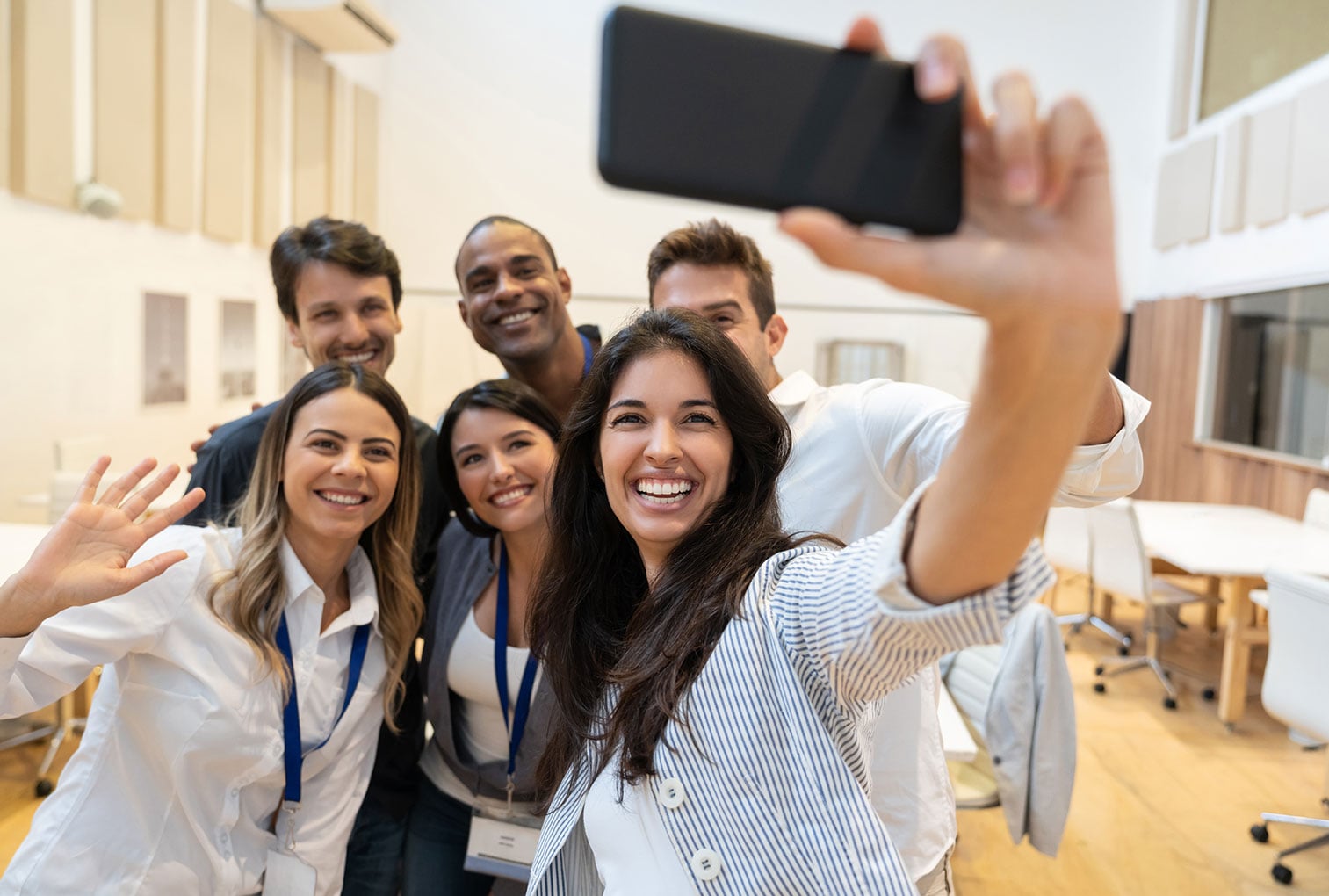 Group of friends taking a selfie in the office